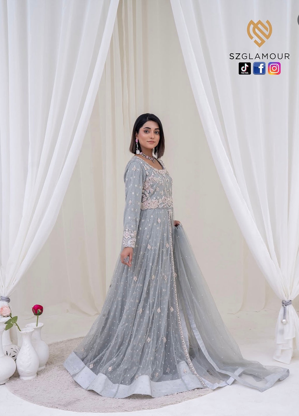 Soft grey net, intricate silver embellishments